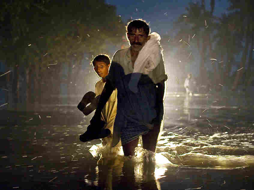 A Pakistani man and boy walk near Basira. A Pakistani man and boy walk near Basira.